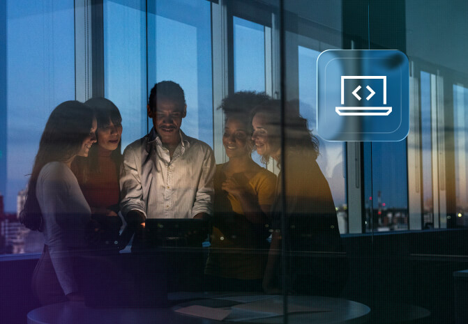 Team of professionals collaborating around a laptop in a modern office at dusk, with a coding icon overlay.