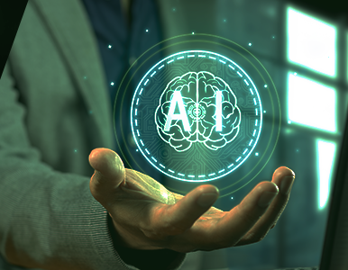 Businessperson's hand holding a glowing holographic AI brain icon, symbolizing artificial intelligence technology.