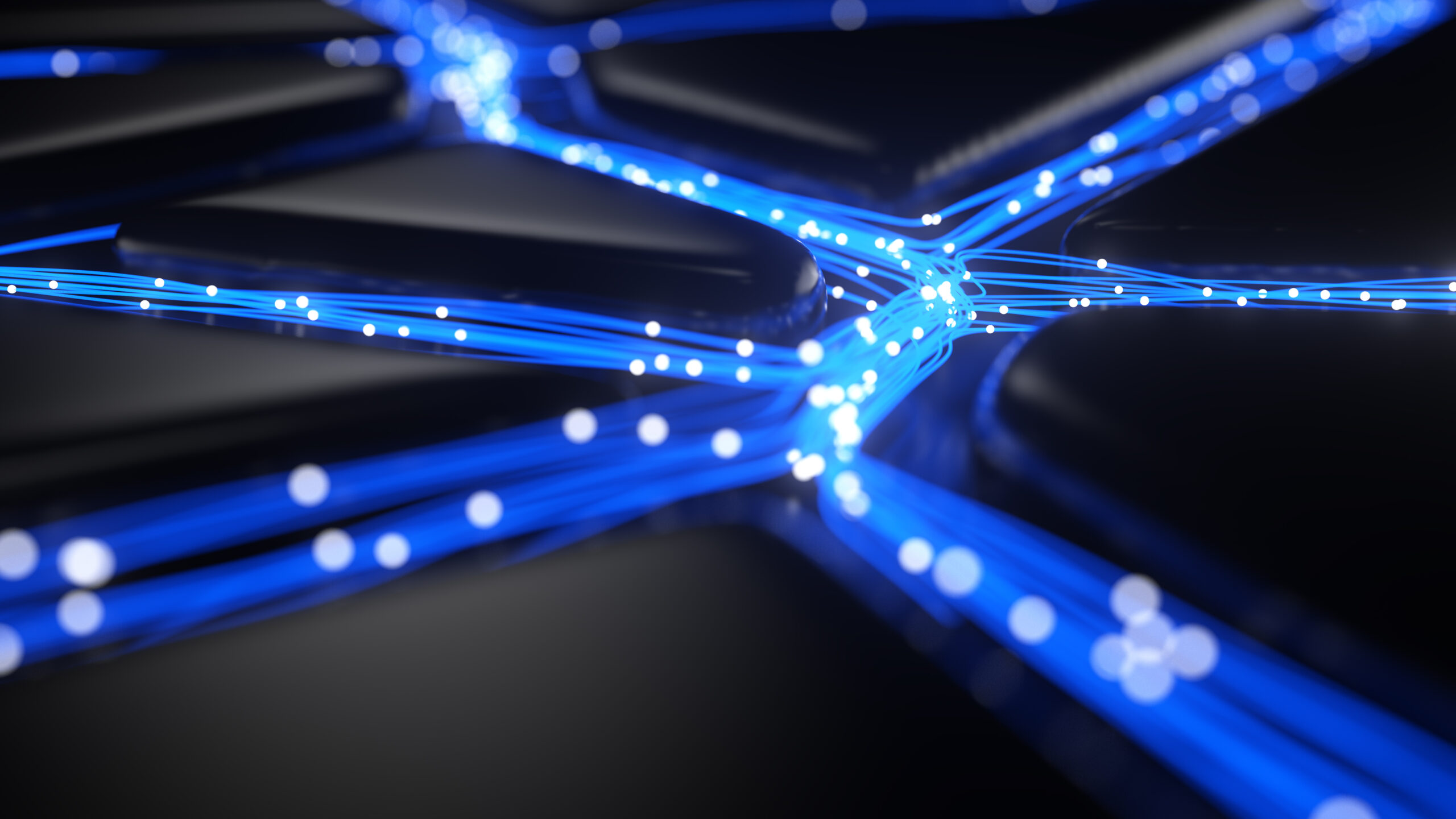 Glowing blue fiber optic strands converge at nodes on a dark surface, representing neural network data flow.