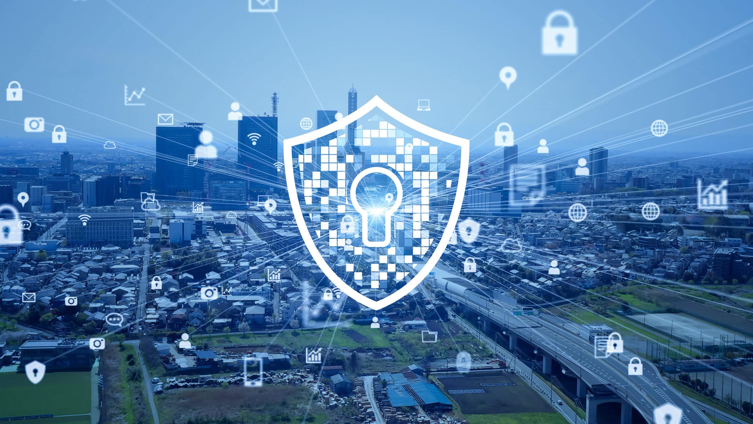 Shield with keyhole icon overlaying a cityscape, surrounded by digital padlock and communication symbols representing
