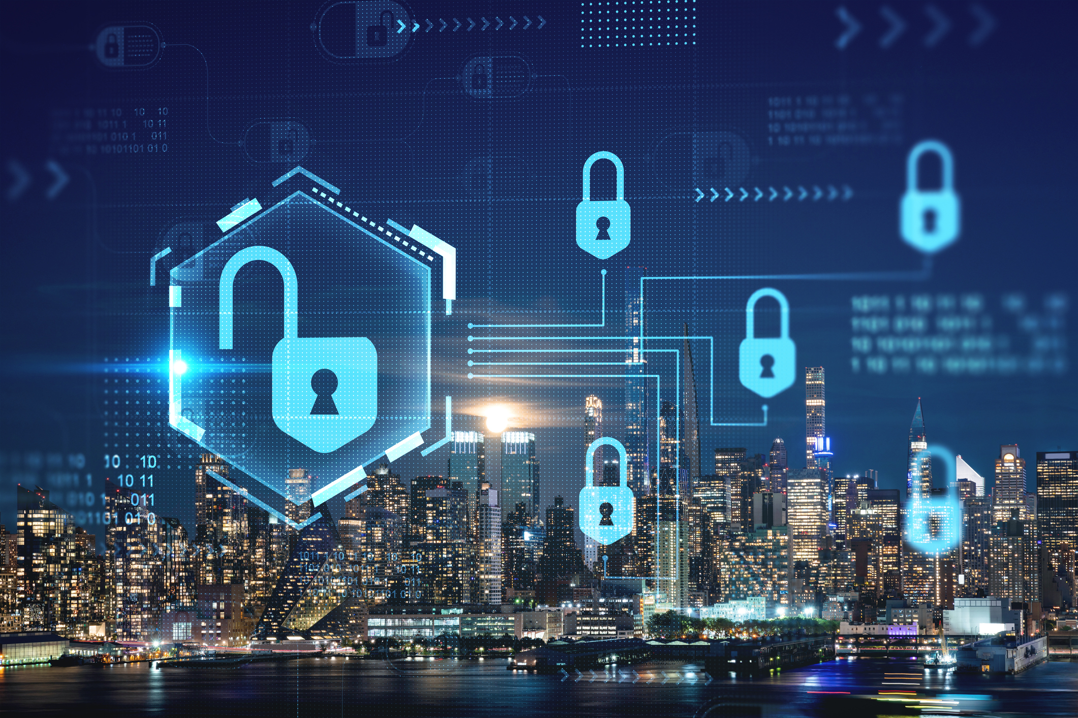 Glowing blue padlock icons and digital data overlay a nighttime city skyline, illustrating cybersecurity concepts.