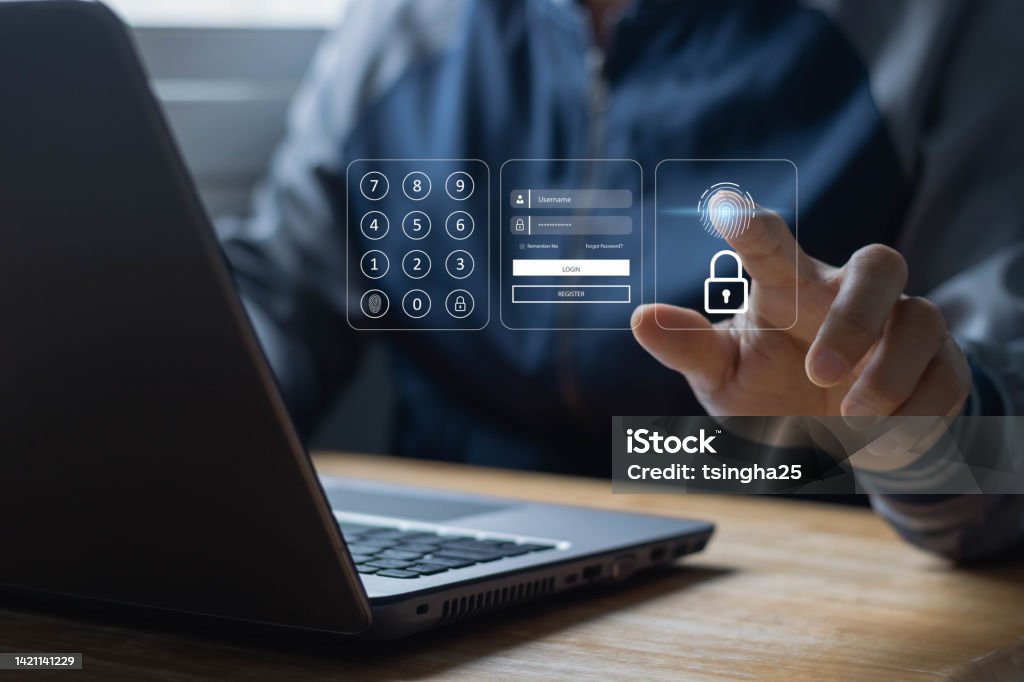 Person using fingerprint authentication on a laptop with virtual login interface displaying keypad and password fields.
